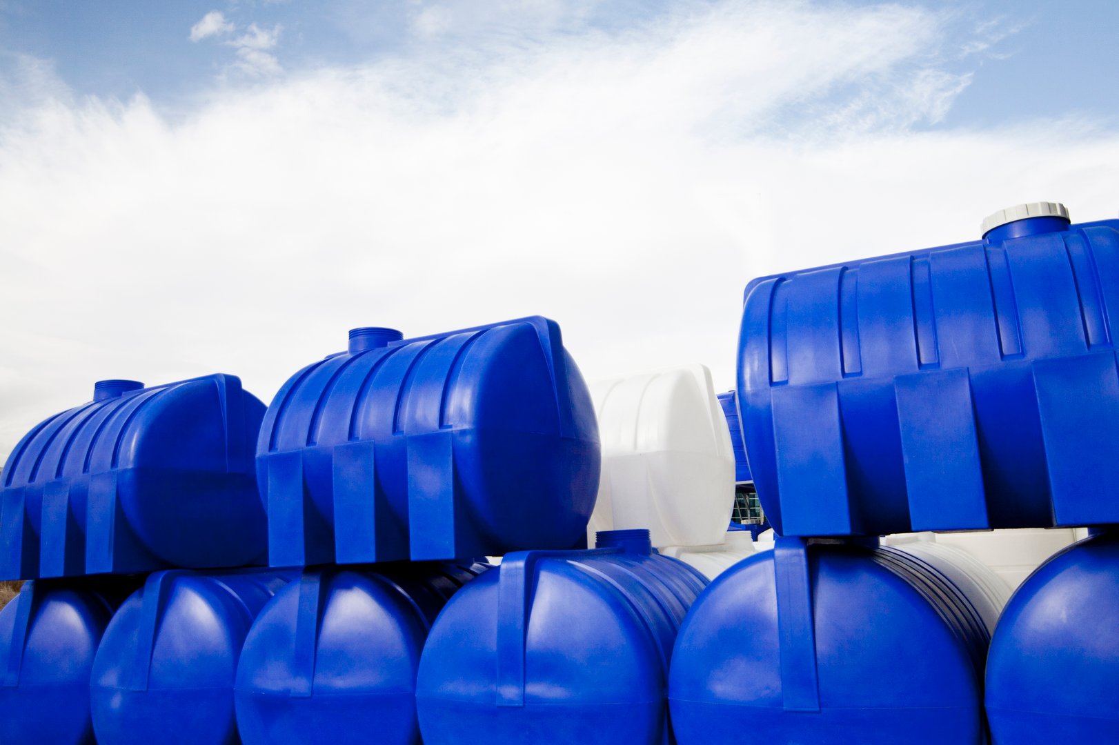 Blue water storage tanks manufactured by Roto Moulders